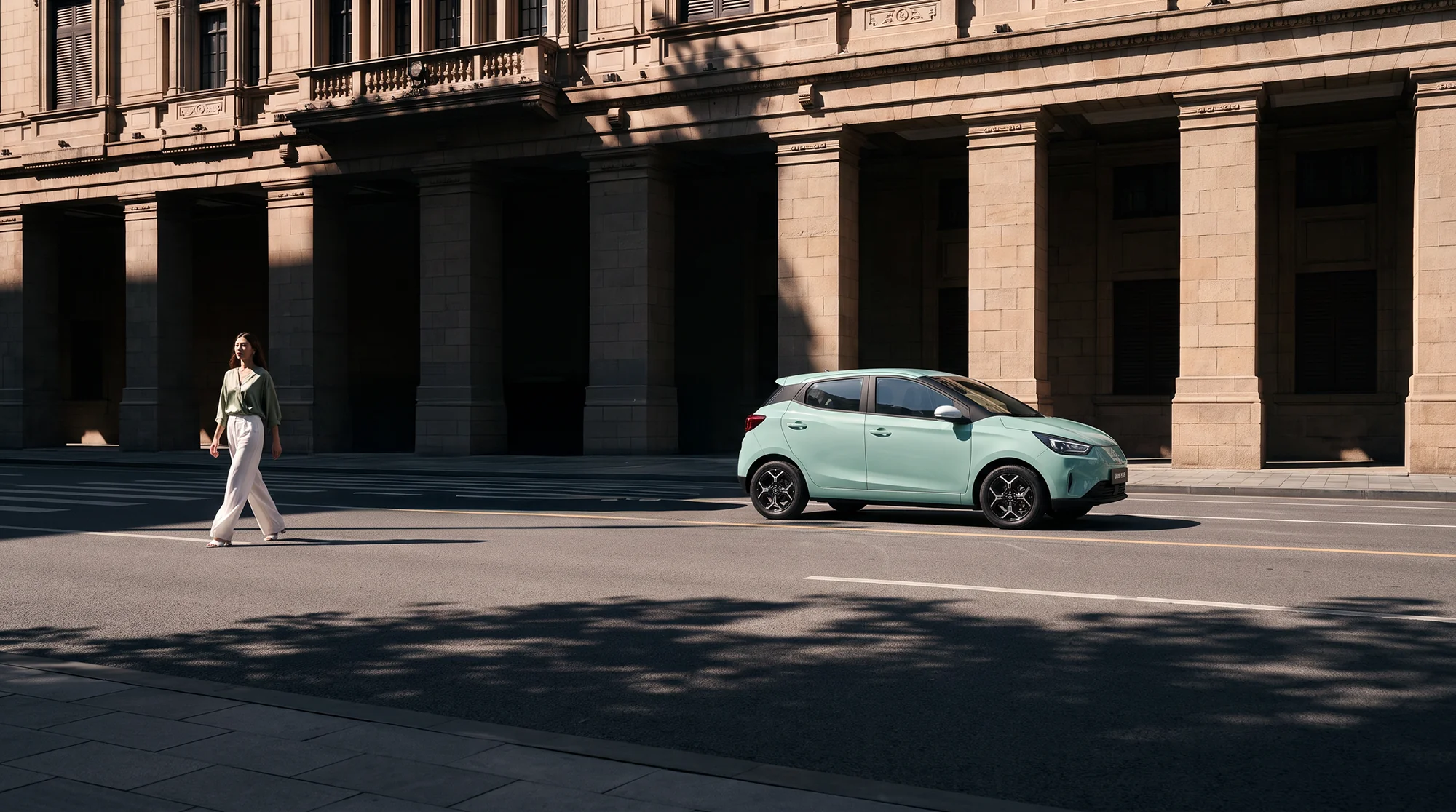 Mint-green JMEV E3 parked on a city street